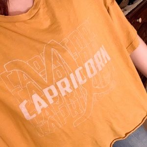SOLD Arie Capricorn Mustard Yellow Flowy Graphic Tee